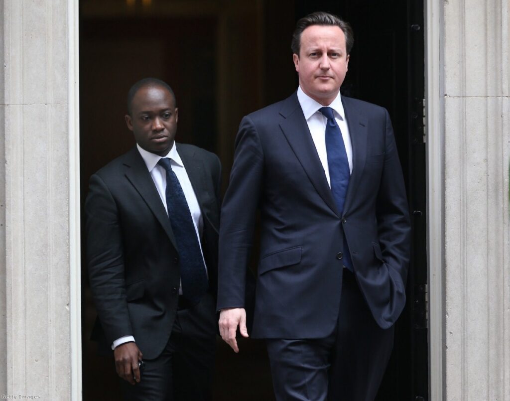 David Cameron leaves Downing Street with his private secretary Sam Gyimah as parliament is called back from recess.