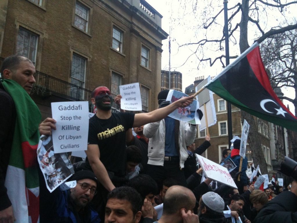 Libyan exiles protest in London. Many want a tougher internatiional response to the violence.