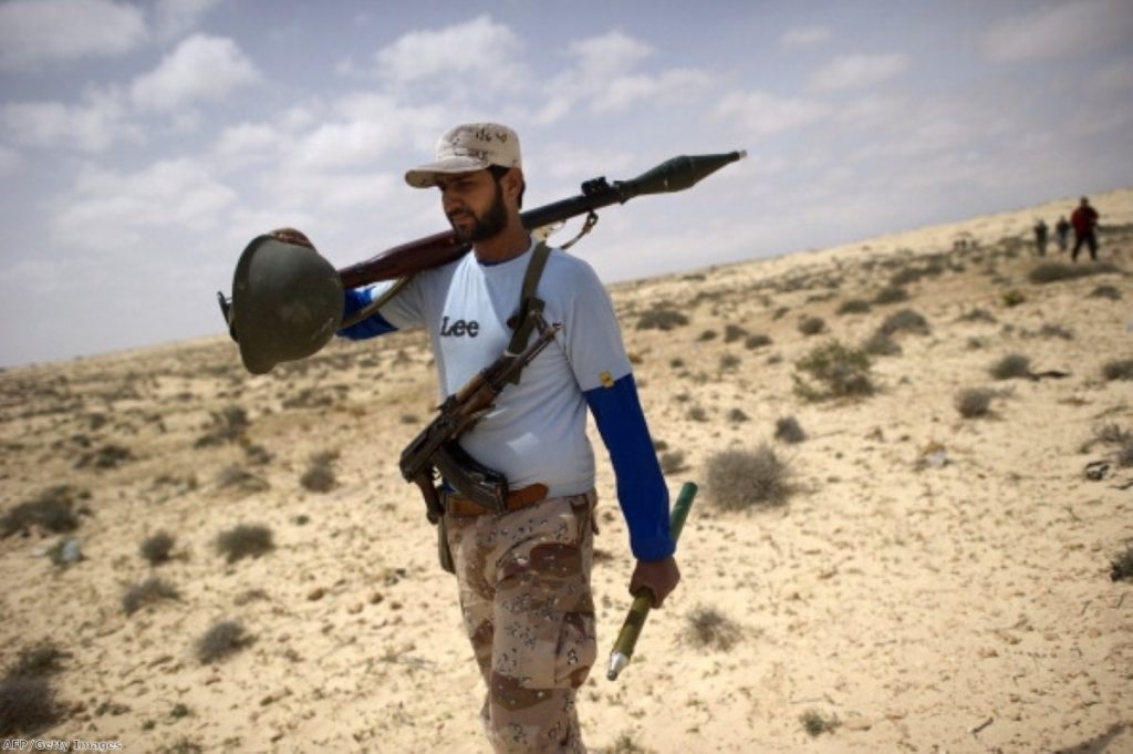 A Libyan rebel walks through the desert. Photo: AFP/Getty Images