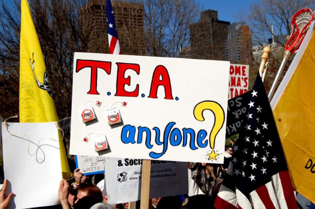 A tea party activist holds up a placard during a Boston rally last April.
