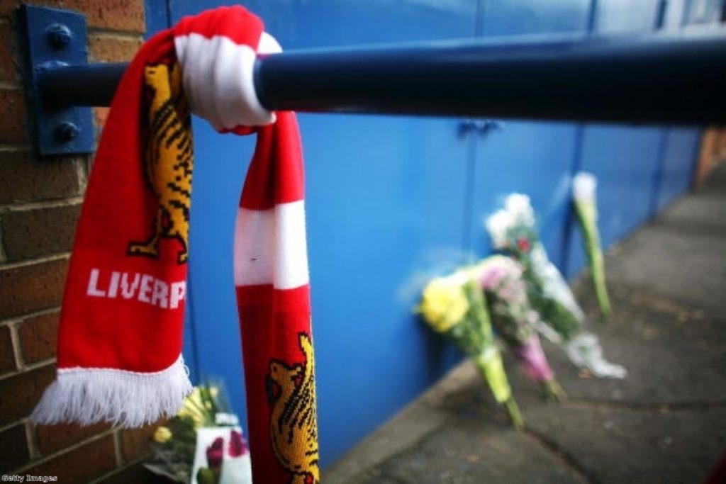 Tributes lie next to the Leppings Lane entrance of Hillsborough Stadium on the 20th anniversary of the Hillsborough disaster on April 14, 2009.