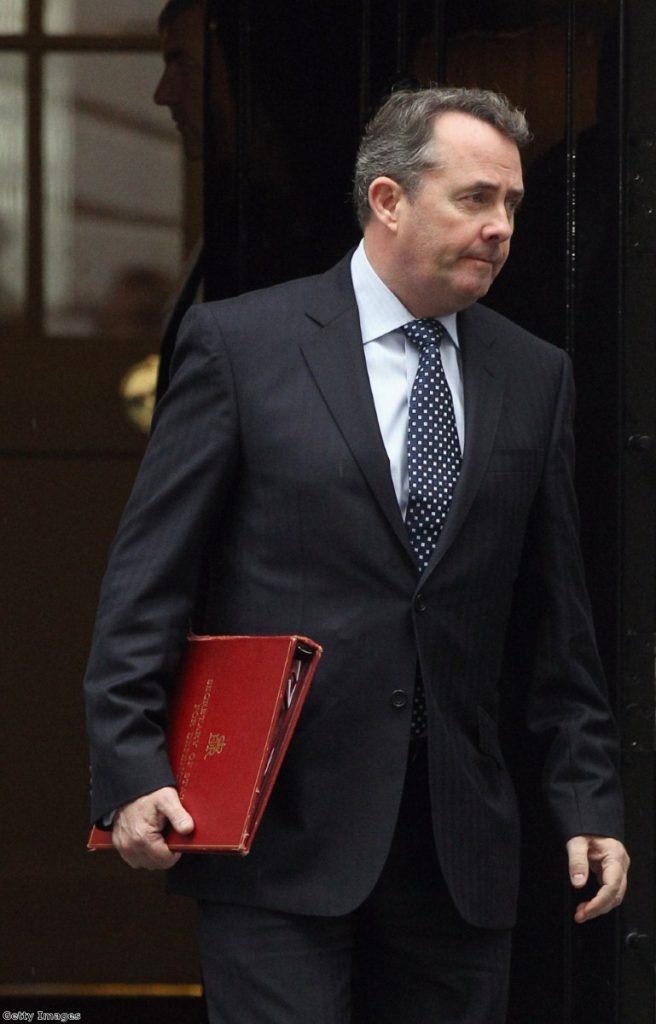 Fox exit? The defence secretary leaves No 10 after a meeting on Libya earlier this year.