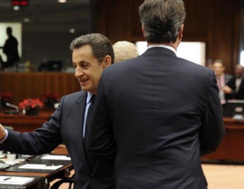 Nicolas Sarkozy and David Cameron cross each other in Brussels