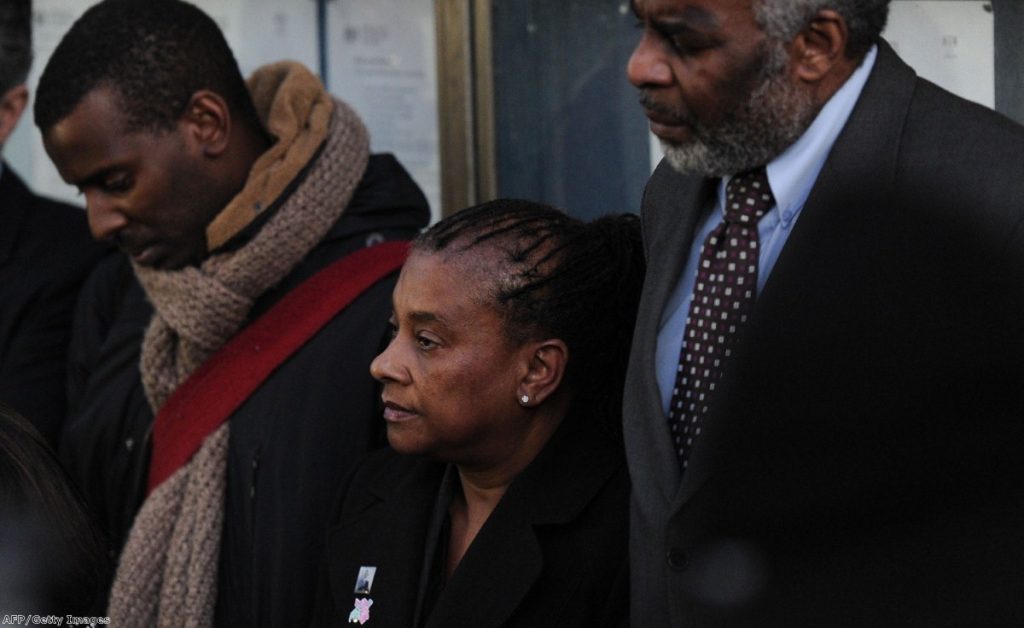 Stephen Lawrence's mother, brother and father in 2012 after his murderers' sentencing. They were subsequently spied on by Met undercover officers