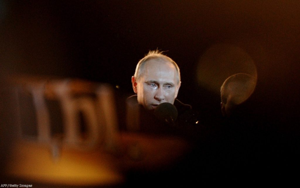 Tears roll down Putin's cheeks as he addresses crowds last night in Moscow.