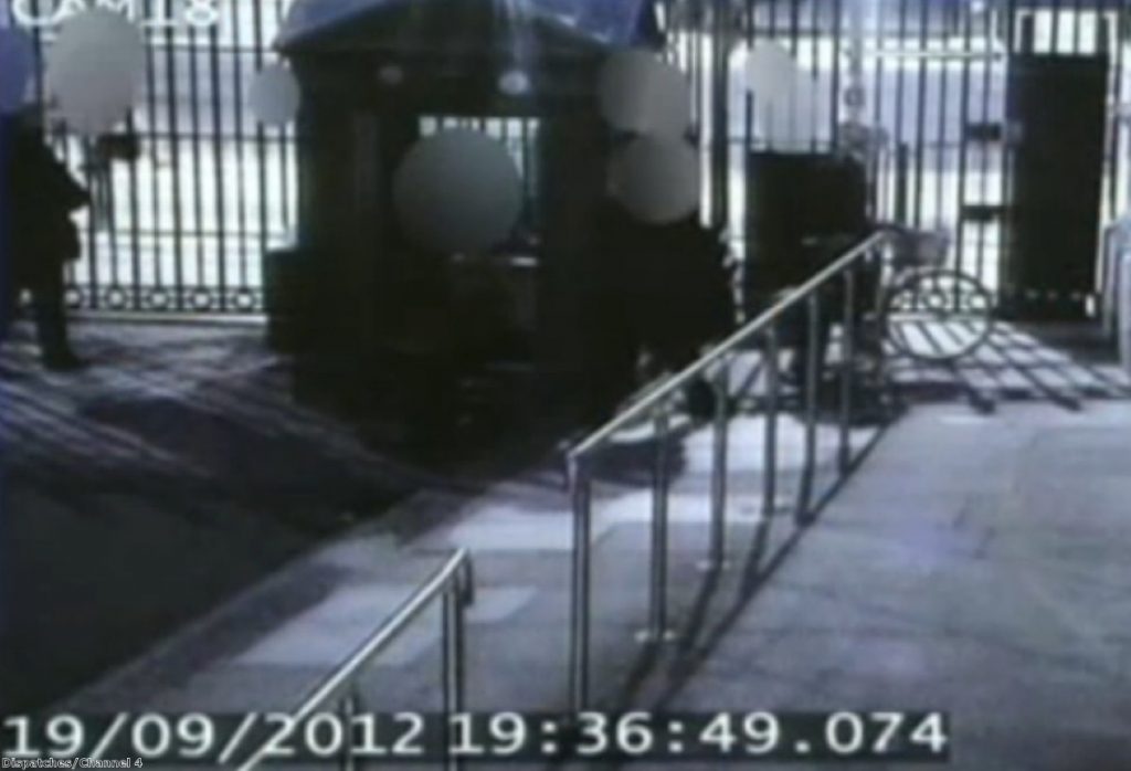 CCTV footage shows Andrew Mitchell leaving Downing Street with his bicycle by the side gate