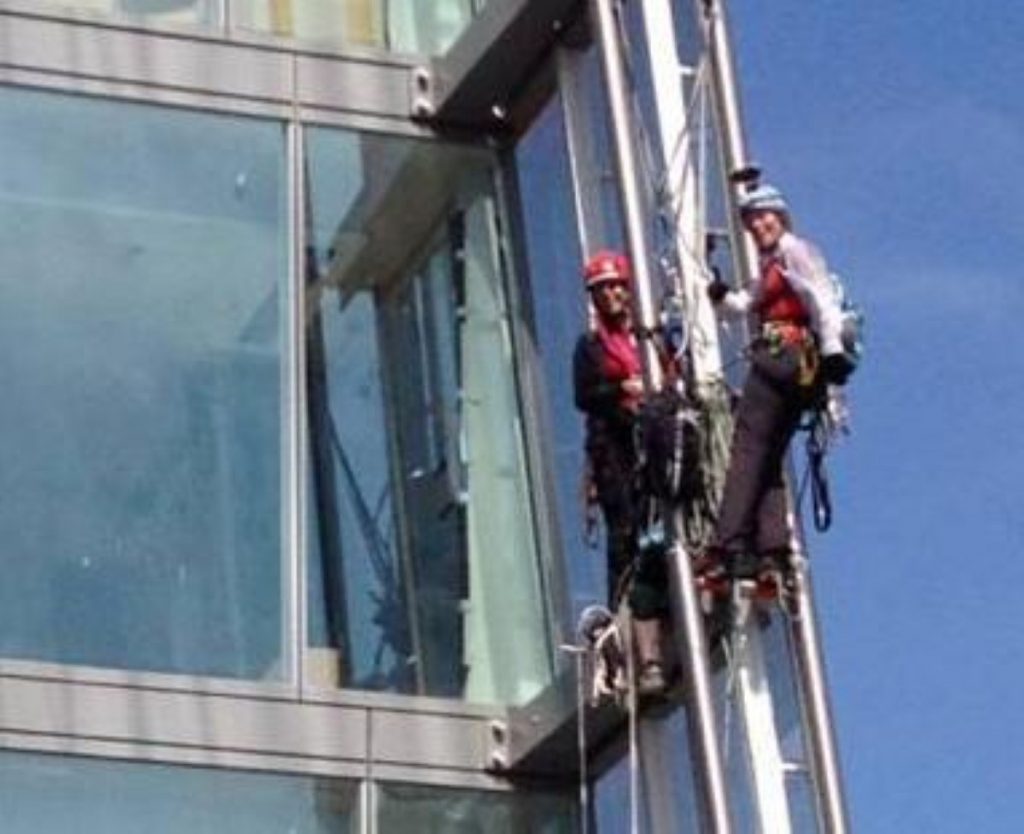 Two of the climbers take a break during their ascent of the Shard