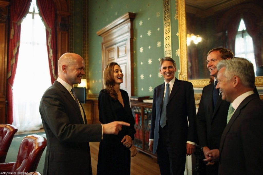 Angelina Jolie shares a joke with British ministers, but in the asylum system, her programme is being ignored