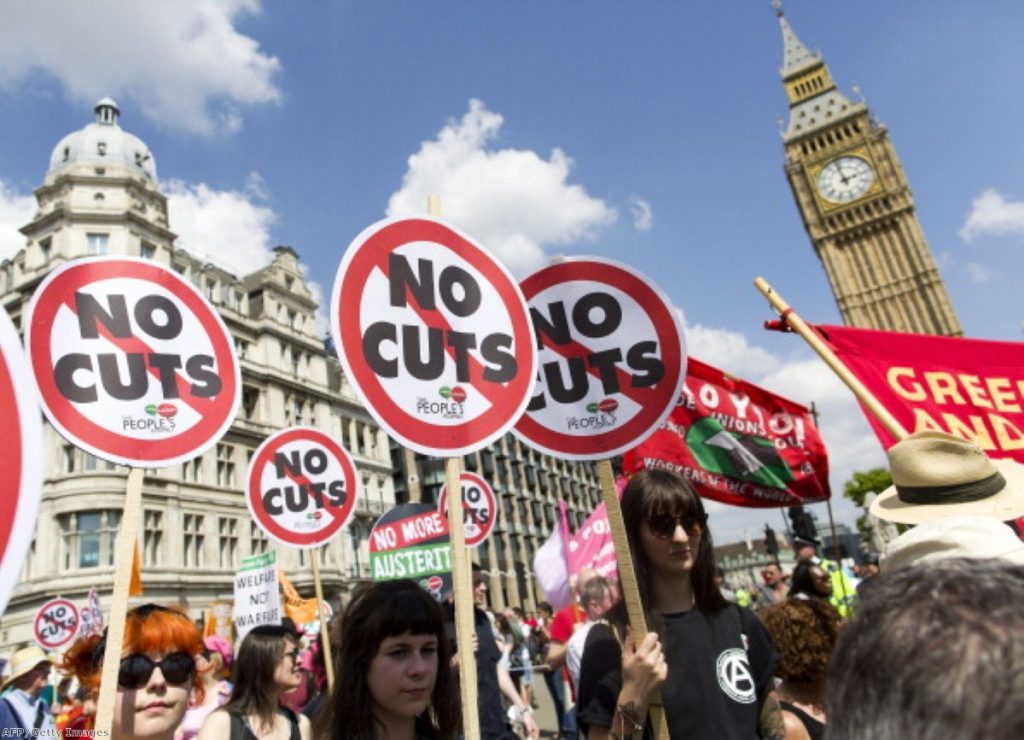 Anti-austerity campaigners march past Parliament last month.