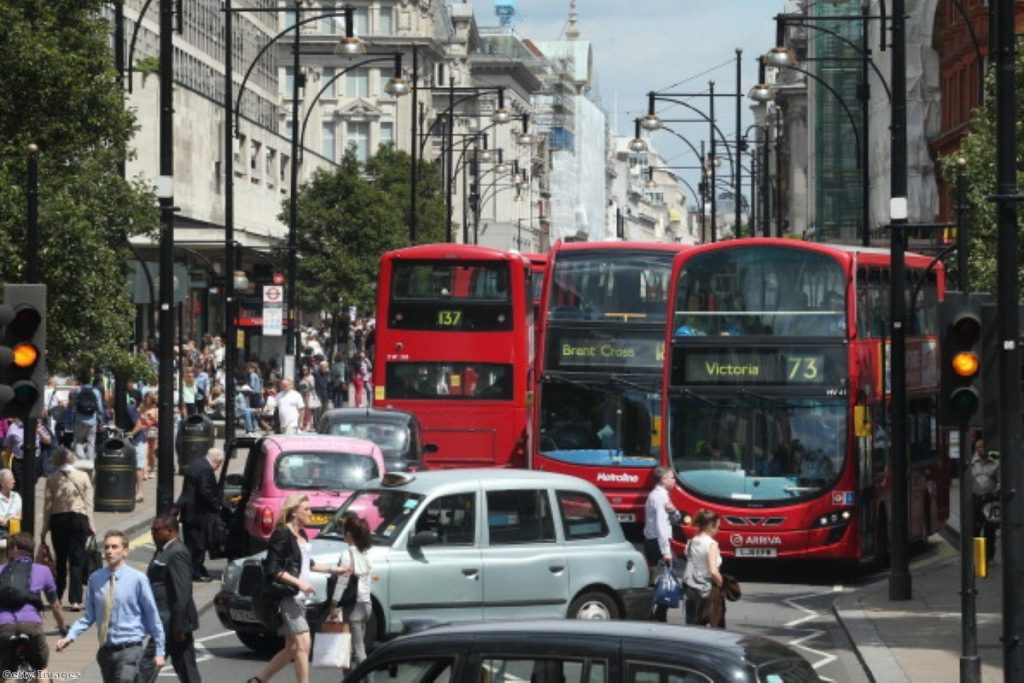 A wall of buses and taxis on London's Oxford Street.