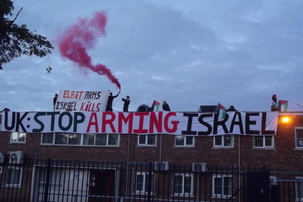 Pro-Palestinian activists on the roof of the factory this morning