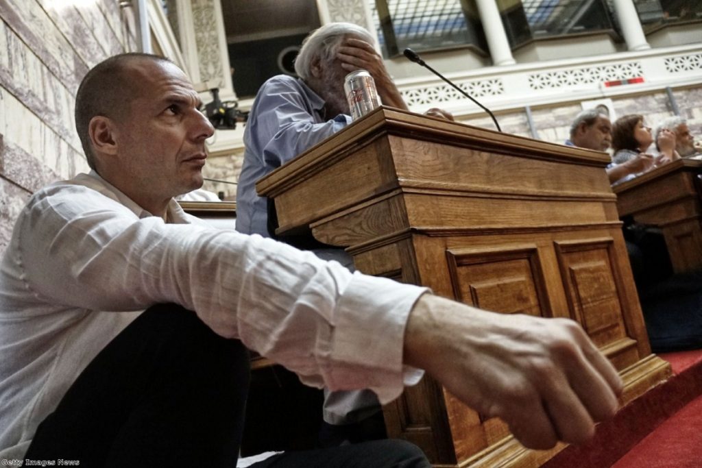 Greek finance minister Yianis Varoufakis attends a meeting as prime minister Alexis Tsipras addresses his party members and ministers at the Greek Parliament