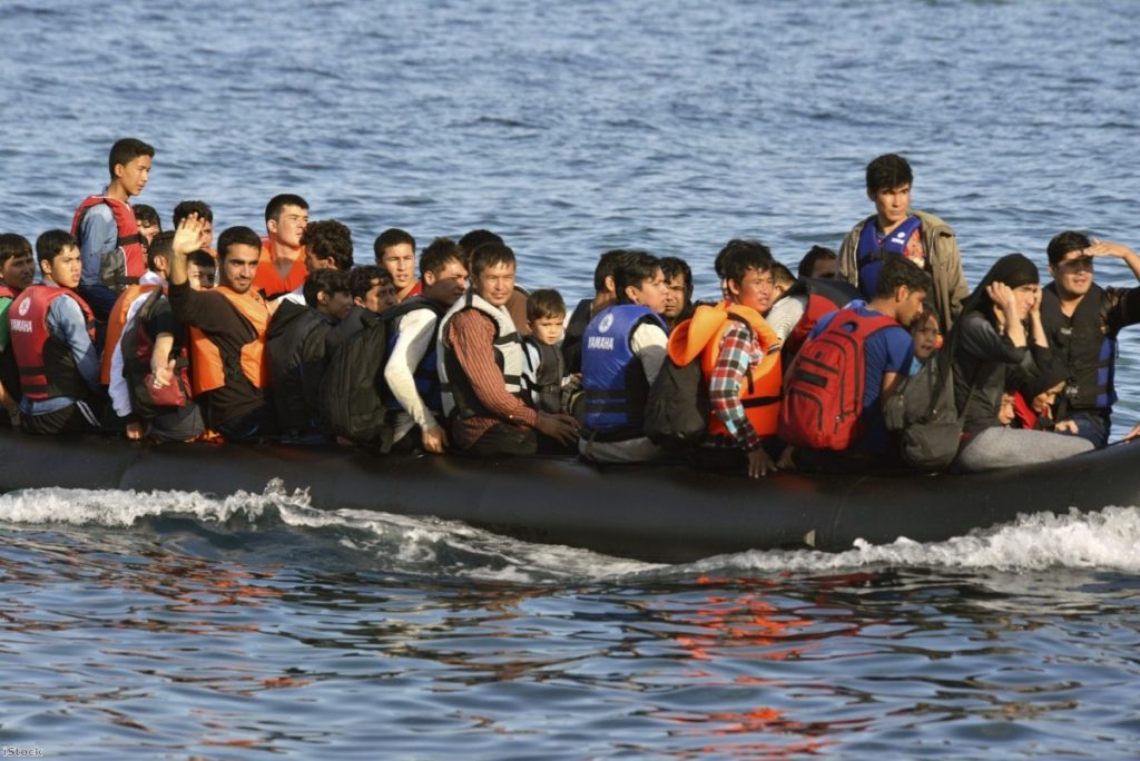 Refugees arriving at the Greek island of Lesbos