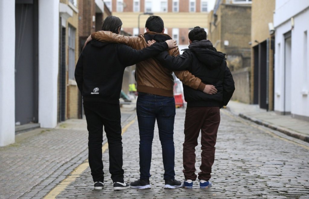 Three recently-arrived Syrian refugees in London earlier this year