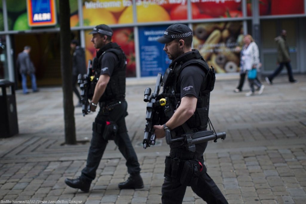 Police officers patrol in central Manchester after Monday's terror attack