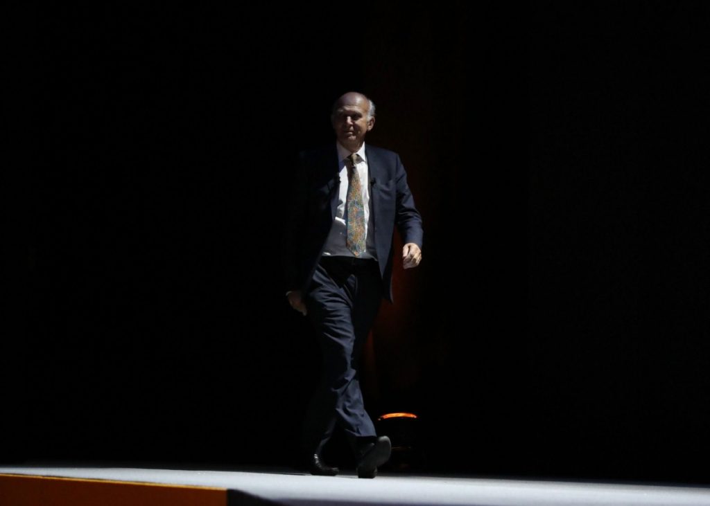 Sir Vince Cable arrives on stage to deliver his keynote speech at the Liberal Democrat annual conference at the Bournemouth International Centre this afternoon 