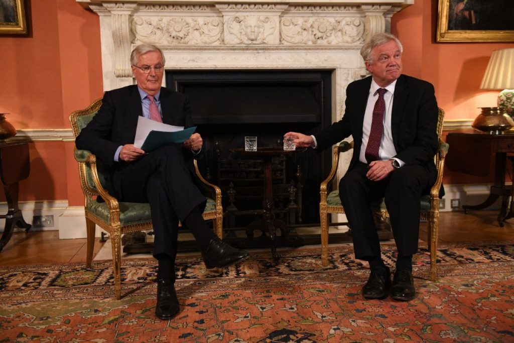 European Commission negotiator Michel Barnier sits with Davis in No.10 last month. 