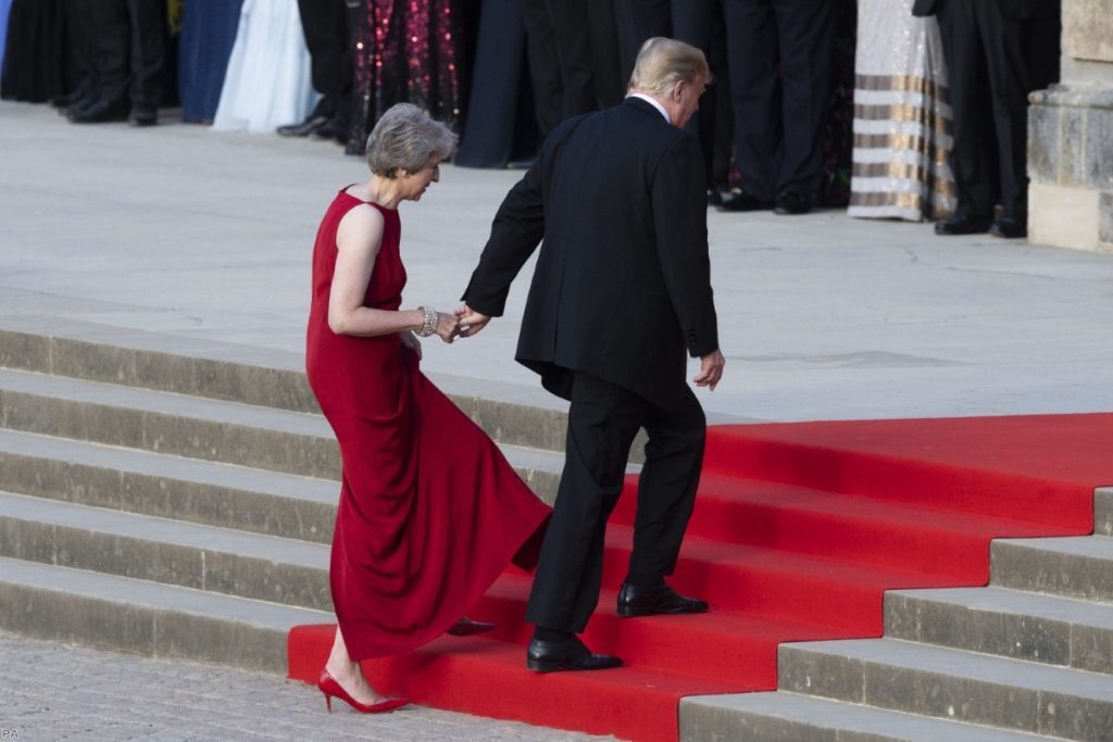 Donald Trump takes the hand of Theresa May as they enter Blenheim Palace on July 12, 2018 | Copyright: PA
