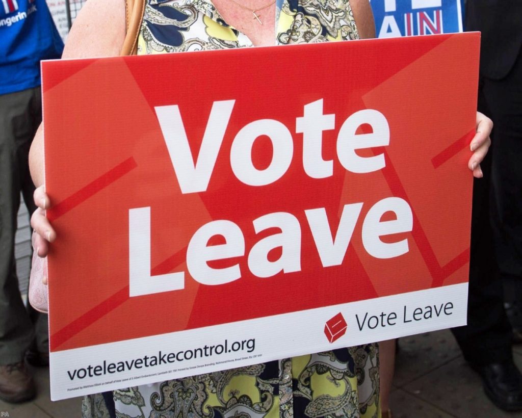 Woman holds a Vote Leave poster on June 7th, 2016 | Copyright: PA