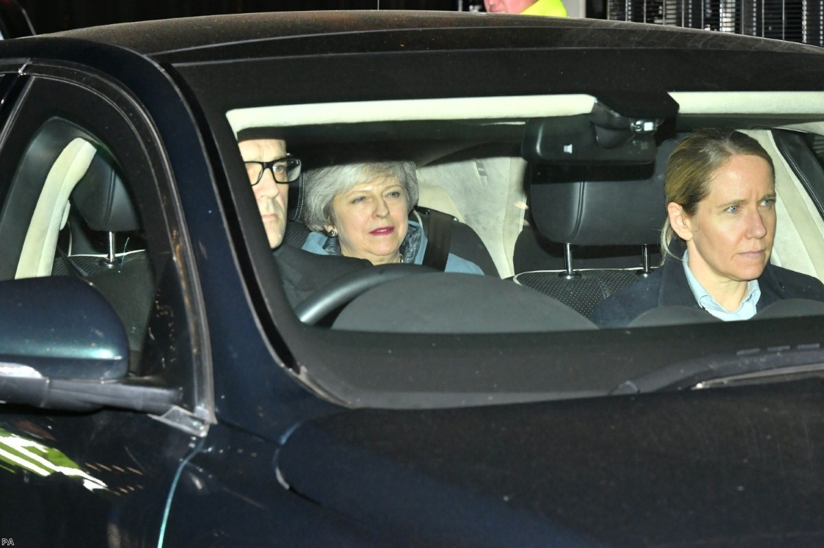 The prime minister leaves Westminster following a Brexit vote she did not attend.