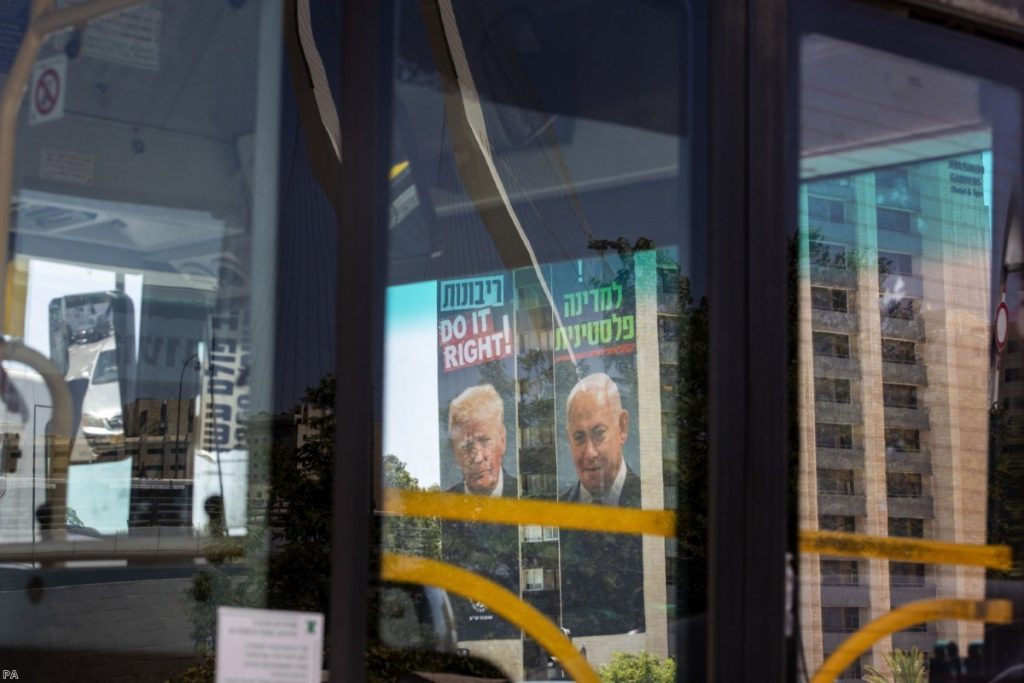 Billboards in Jerusalem placed by Yesha Council, an organisation of municipal councils of Jewish settlements in the West Bank, show Benjamin Netanyahu alongside Donald Trump.