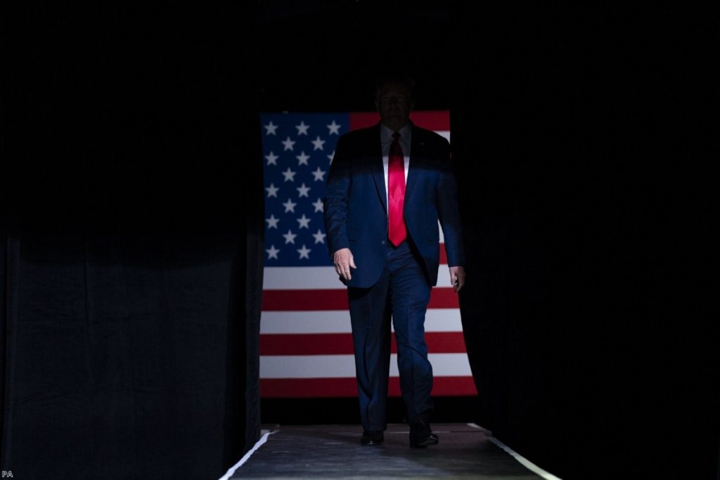 President Trump arrives on stage in Tulsa, Okla.