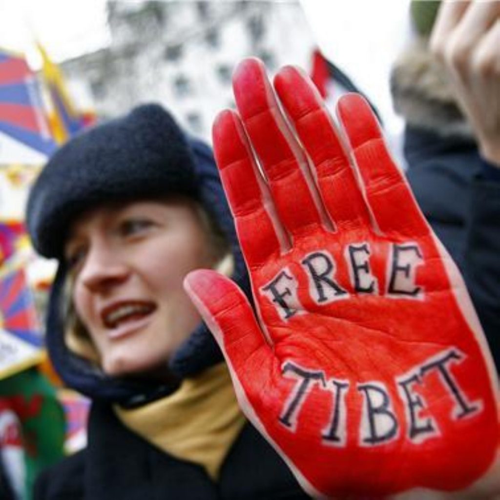 Olympic torch guards were seen manhandling protesters