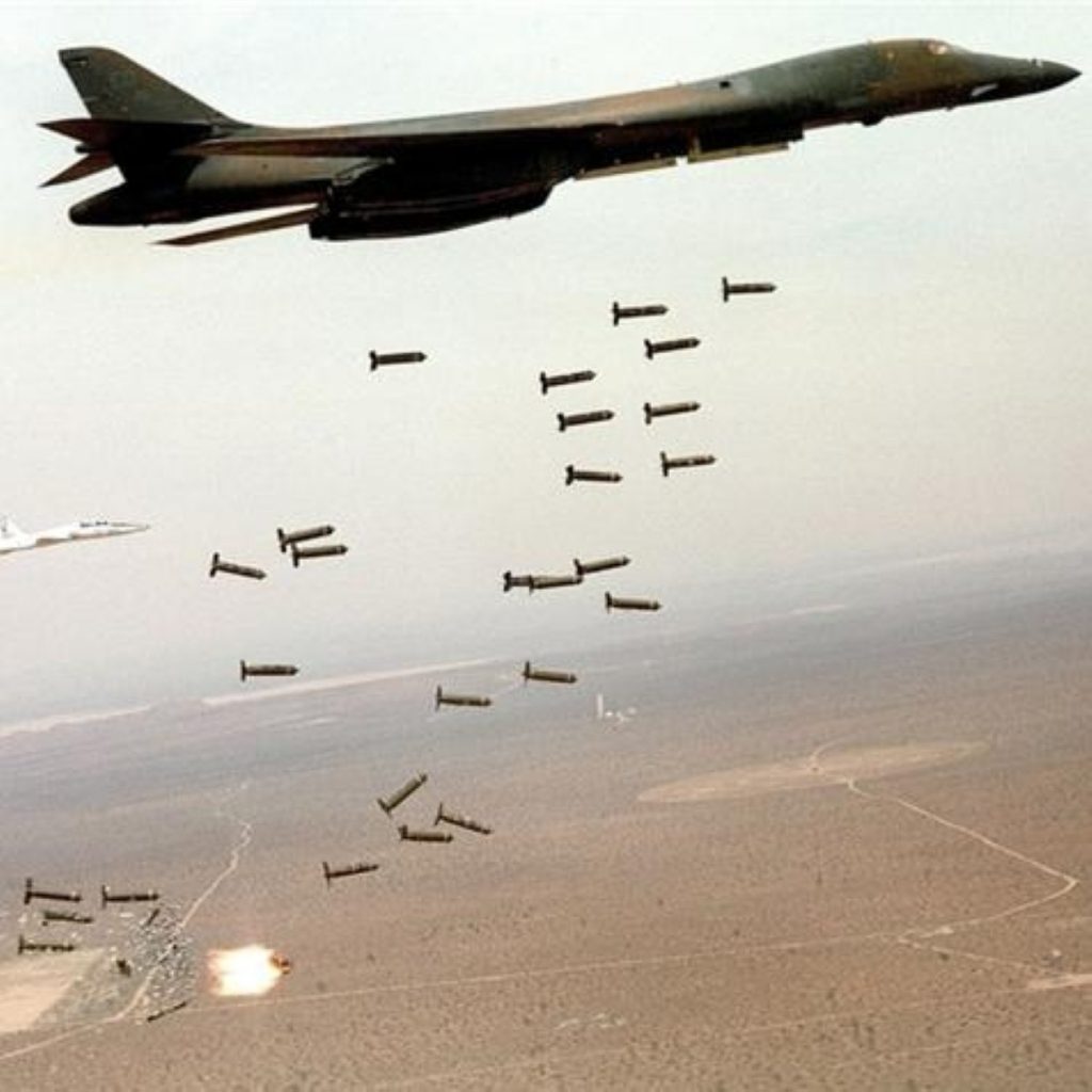 A US aircraft dropping cluster bombs