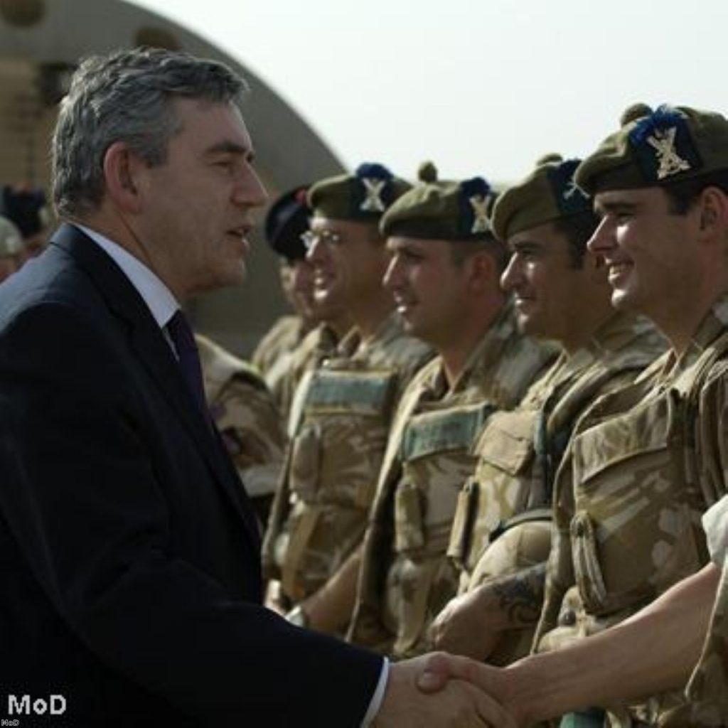 Troops with Gordon Brown during a visit to the country last year