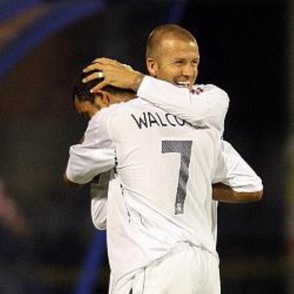 David Beckham congratulates Theo Walcott after the last England qualifier