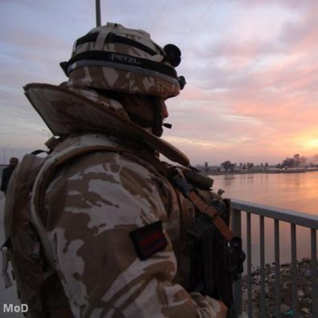 A UK soldier looks out on Iraq. MPs voted on war before the invasion took place.
