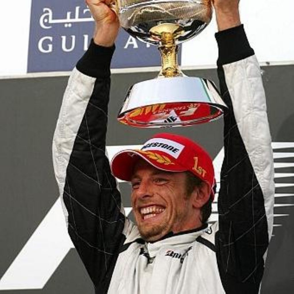 Jenson Button celebrates a past win at the Bahrain grand prix