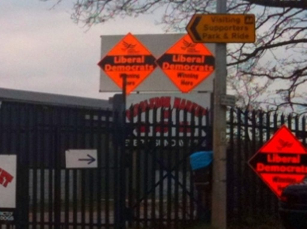 Chris Huhne's signs have been ordered down in case they distract drivers