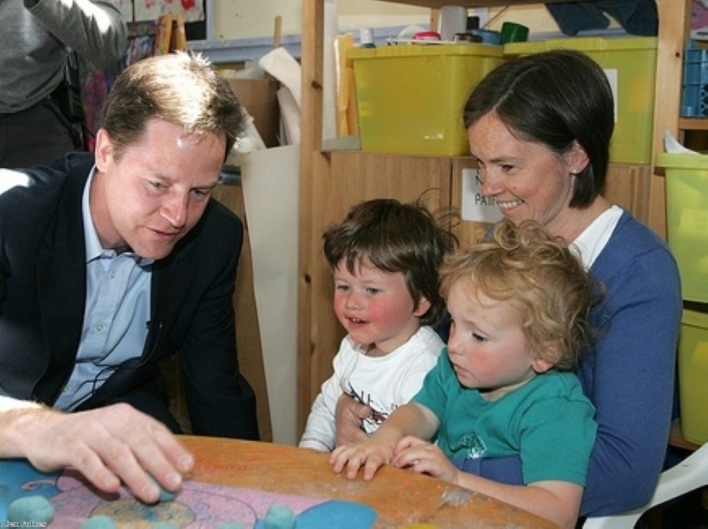 Nick Clegg entertains children at the Imps playgroup in Bristol before the debate