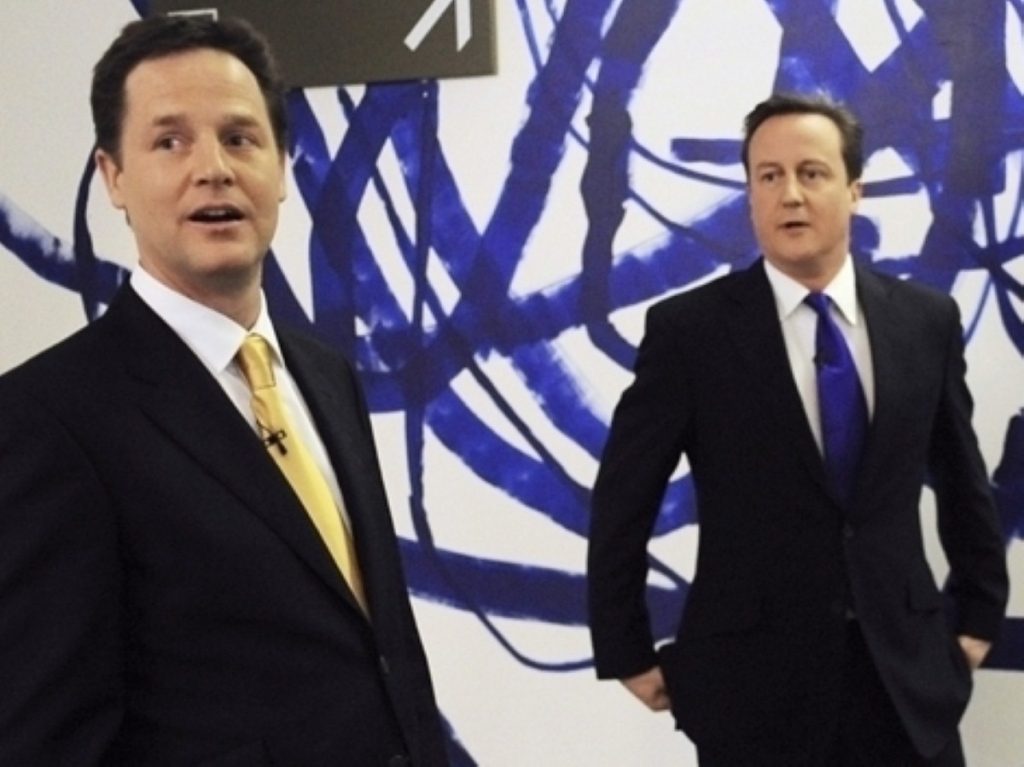 Divergent fortunes: Cameron picks up the pieces while Clegg celebrates