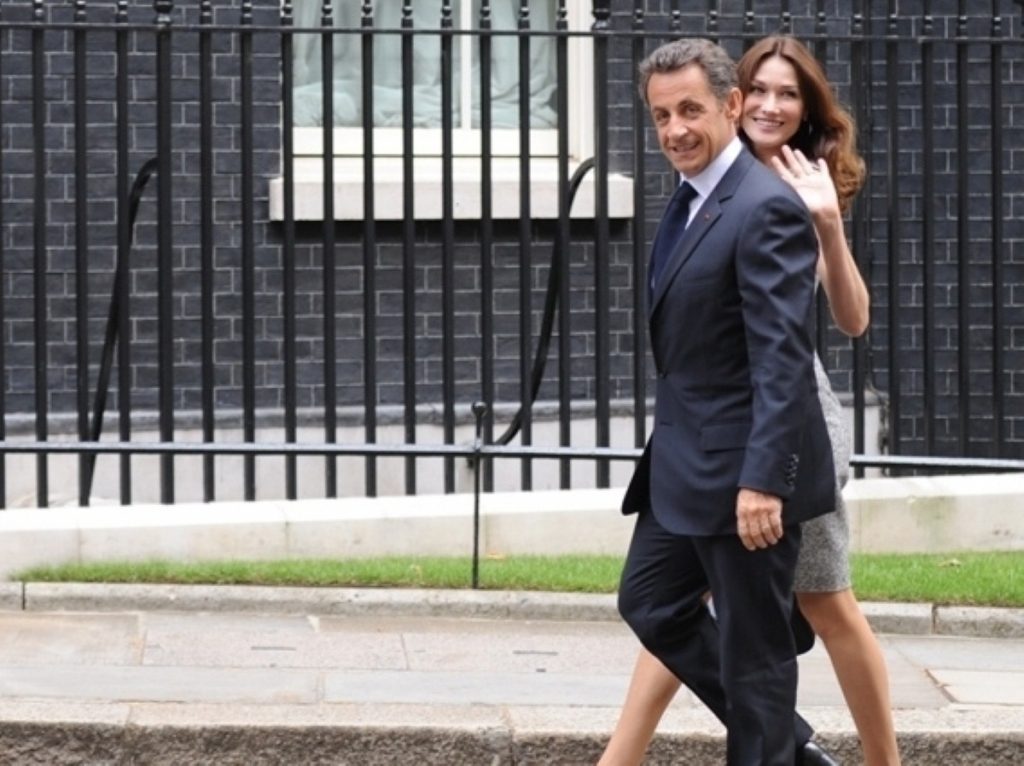 Nicolas Sarkozy and Carla Bruni walk to Downing Street