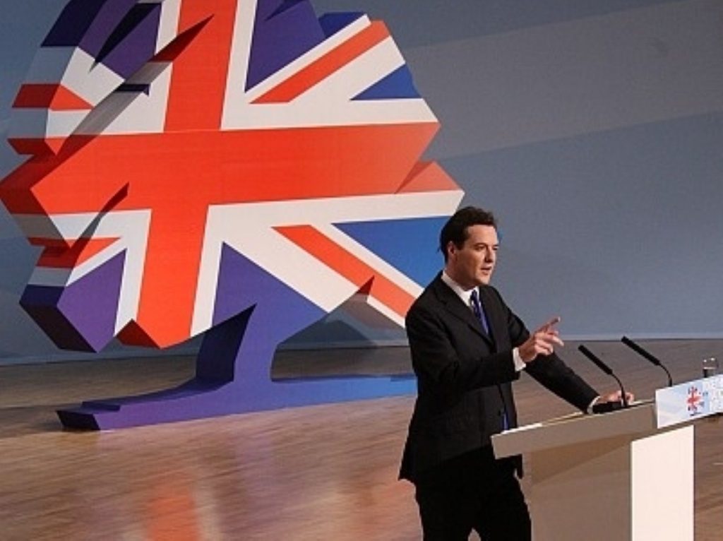 George Osborne on stage, David Cameron somewhere in the audience
