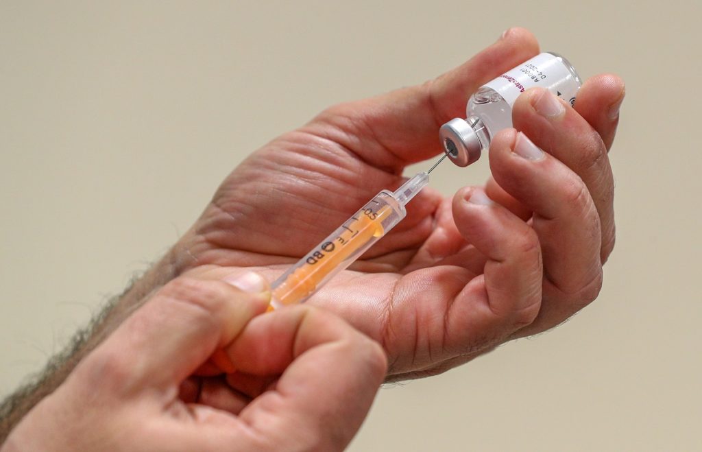 NHS staff prepare to administer a Oxford/AstraZeneca Covid-19 vaccine