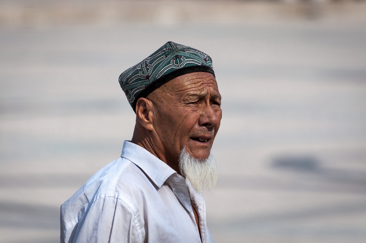 Portrait of a Uyghur man at a street in the city of Kashgar, Xinjiang