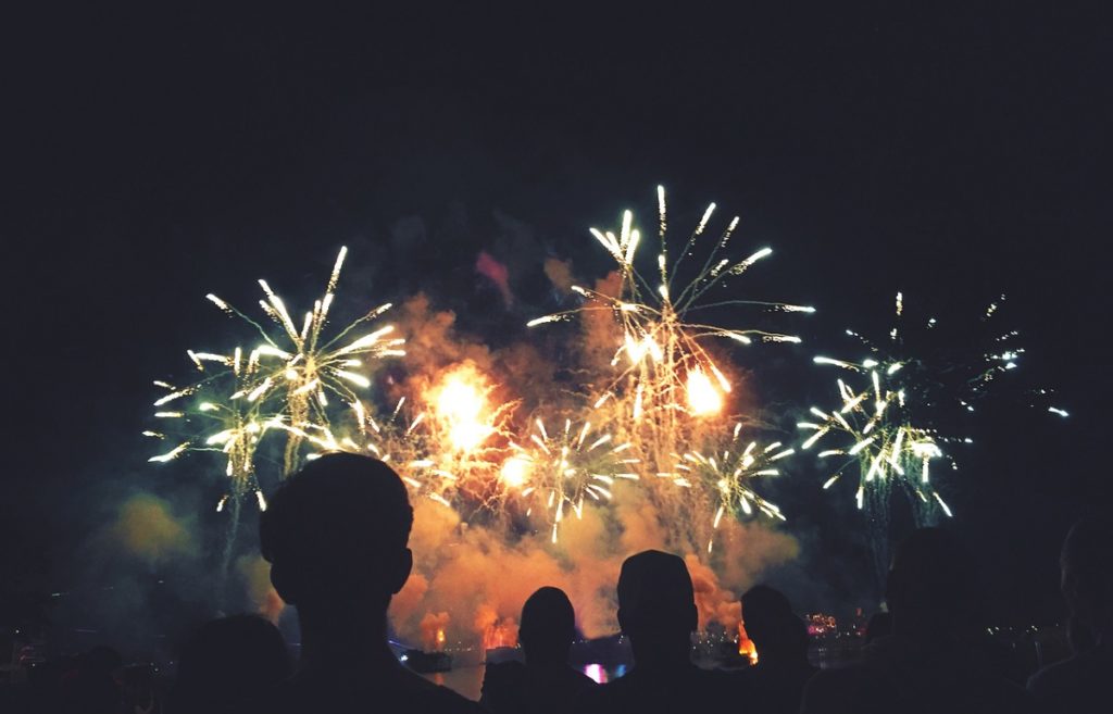 Silhouetted People Watching a Fireworks Display