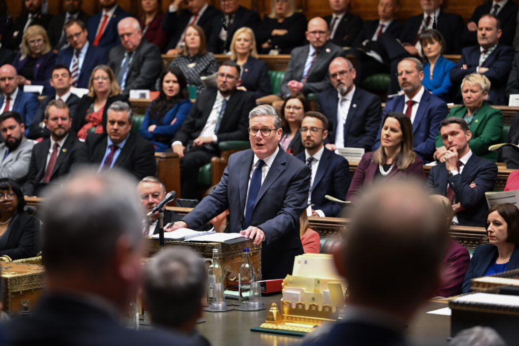 Keir Starmer at PMQs with Labour MPs behind him